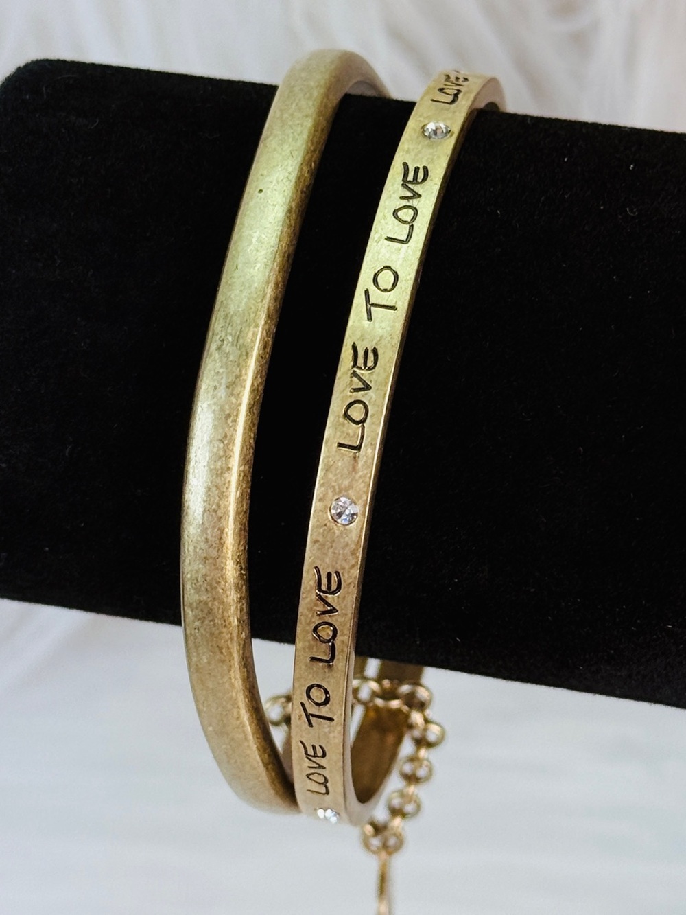 Aged Brasstone Goldtone Love to Love inscribed Jessica Simpson Bangle Bracelets